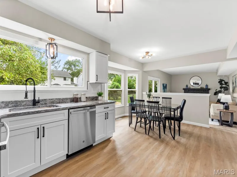 NEW Kitchen with Custom White shaker cabinetry, granite countertops and new stainless steel appliances — 920 Blake Court, St Peters, MO 63376