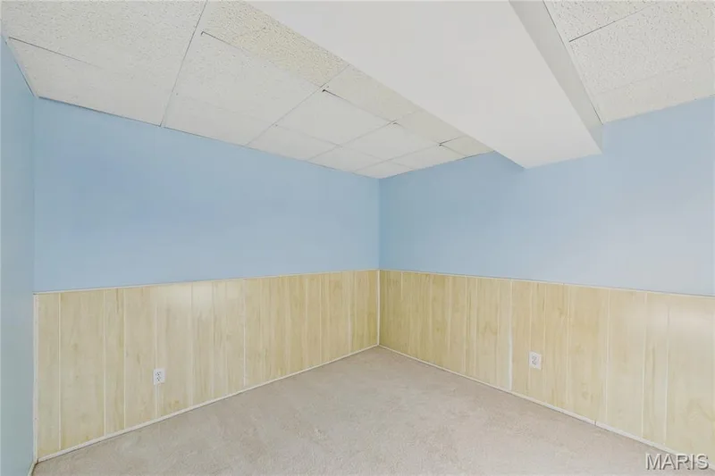 Sleeping area or office w/Drop ceiling, two-tone walls with light-toned wainscoting, and carpeted flooring — 2931 Plum Leaf Circle, St Peters, MO 63303