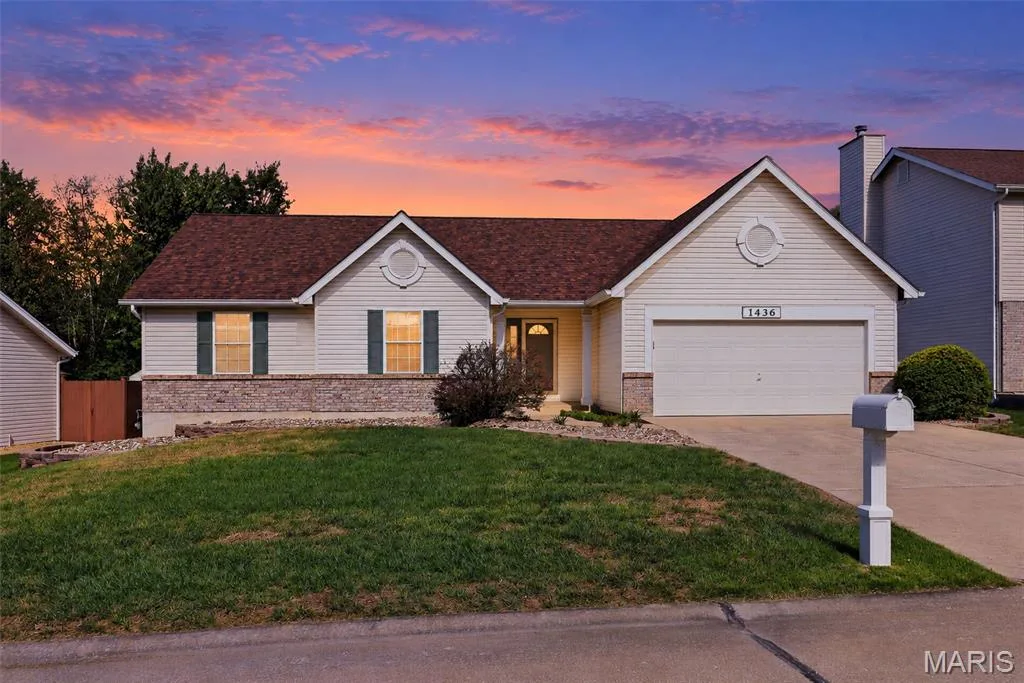 Twilight view of the front of the house — 1436 Snowbird Lane, O'Fallon, MO 63366