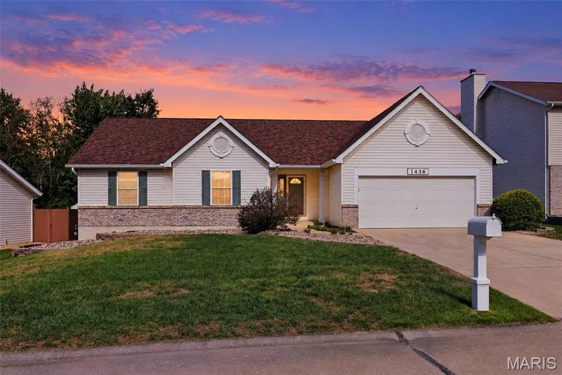 Twilight view of the front of the house — 1436 Snowbird Lane, O'Fallon, MO 63366