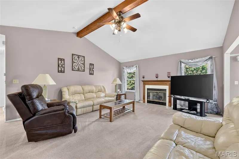 Vaulted Ceiling w/Beam, Gas Fireplace, Two Windows, Carpeting — 1436 Snowbird Lane, O'Fallon, MO 63366