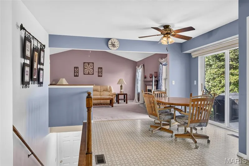 View from Kitchen of the Open Floor Plan and Breakfast Room Area, Sliding Glass Doors to the Patio — 1436 Snowbird Lane, O'Fallon, MO 63366