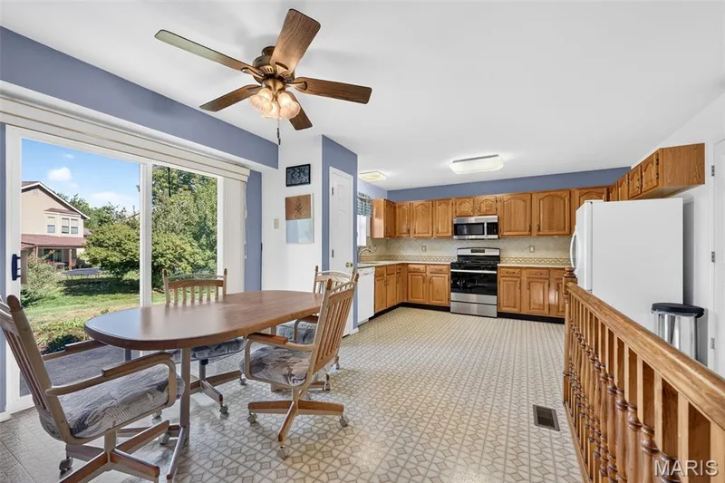 View from Living Room into Kitchen, Sliding Glass Door — 1436 Snowbird Lane, O'Fallon, MO 63366