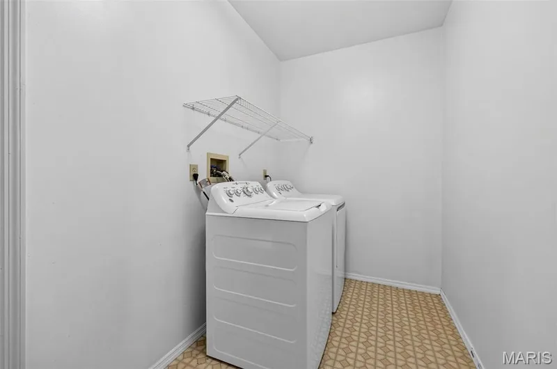 Main Floor Laundry located between the Kitchen and the garage — 1436 Snowbird Lane, O'Fallon, MO 63366