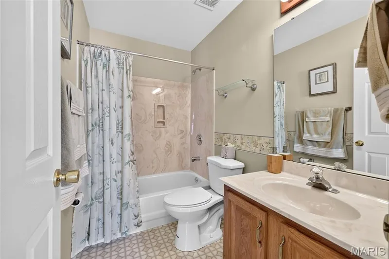 Hall Bathroom with Single Sink Vanity with Lots of Counter Space and Tub/Shower Combo — 1436 Snowbird Lane, O'Fallon, MO 63366