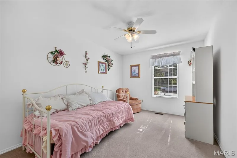 Bedroom with Ceiling Fan and Carpeting — 1436 Snowbird Lane, O'Fallon, MO 63366