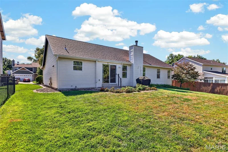 View up the Side yard and Backyard are with Patio — 1436 Snowbird Lane, O'Fallon, MO 63366