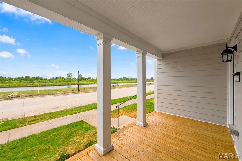 Covered front porch with white columns, and James Hardy siding — 9023 Wilkie Station Street, St Charles, MO 63301