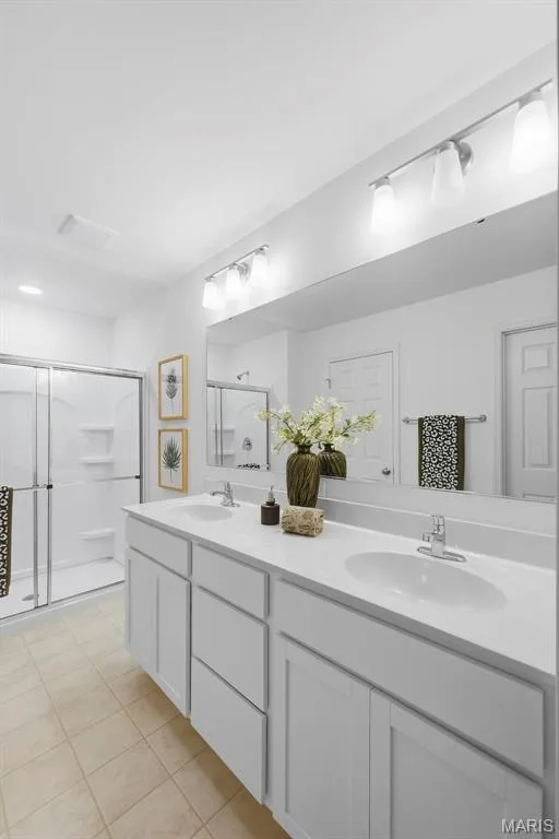 Double vanity with integrated sinks and chrome fixtures — 9023 Wilkie Station Street, St Charles, MO 63301