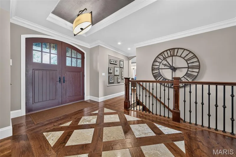 Hardwood and inset designer tile entrance foyer, iron spindles & wood rail — 2000 Diehr Road, Wentzville, MO 63385