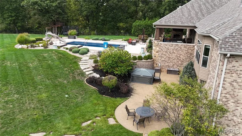 View of lower patio with 6-8 person hot tub — 2000 Diehr Road, Wentzville, MO 63385