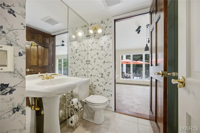 Powder room off the foyer and entry to Hearth/Gaming room — 76 River Valley Drive, Chesterfield, MO 63017