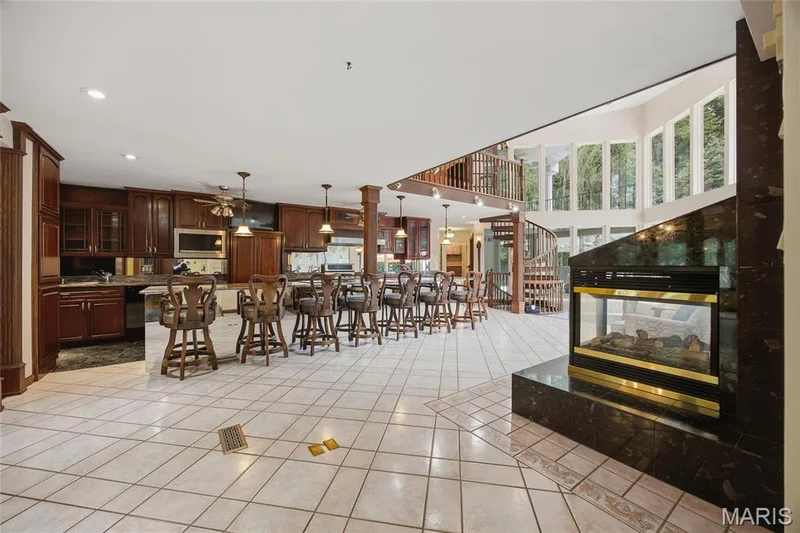 Wide view of the expansive Kitchen with gas fireplace — 76 River Valley Drive, Chesterfield, MO 63017