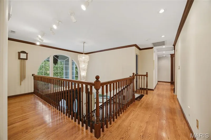 Hardwood flooring and dark wood trim accents — 76 River Valley Drive, Chesterfield, MO 63017