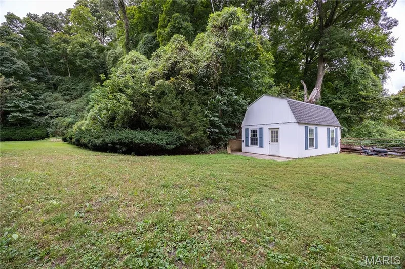 Plenty of green space for the kids and pets to still use and play. Roof matches the house and was also replaced in 2024 with the main roof. — 76 River Valley Drive, Chesterfield, MO 63017
