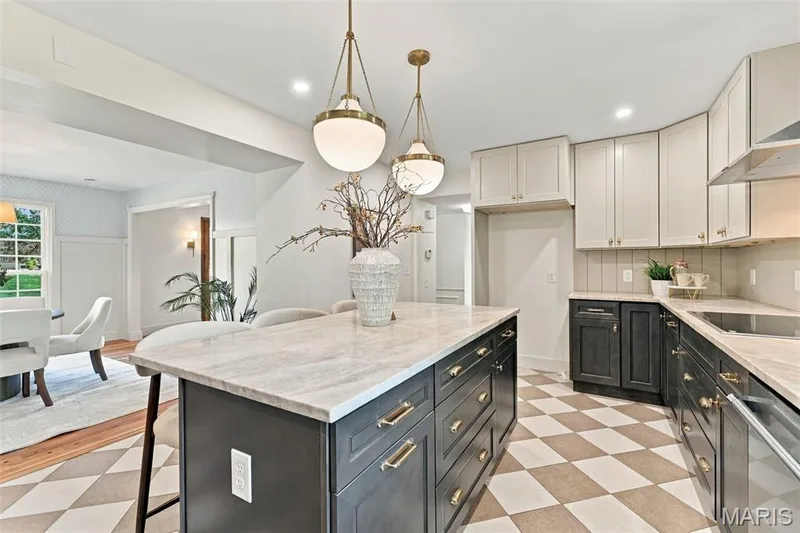 New Two-tone custom cabinetry, quartz countertops, stainless steel appliances, central island with seating, pendant lighting, shiplap backsplash and checkered tile flooring — 621 Claymont Estates Drive, Chesterfield, MO 63017