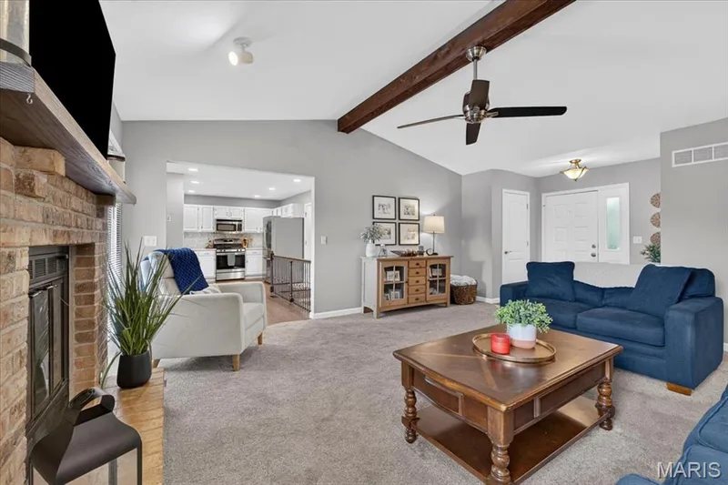 Living room opens to kitchen — 3037 Valley Vista Drive, St Peters, MO 63376