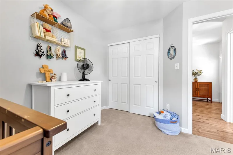 Light-toned carpeting, white sliding closet doors, and light gray wall paint — 5507 Dressel Drive, Cottleville, MO 63304