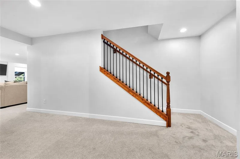Light-toned carpeting with white baseboards — 5507 Dressel Drive, Cottleville, MO 63304
