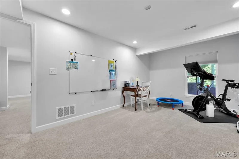 Recessed lighting, light gray wall paint, window with roller shade, and carpeting — 5507 Dressel Drive, Cottleville, MO 63304