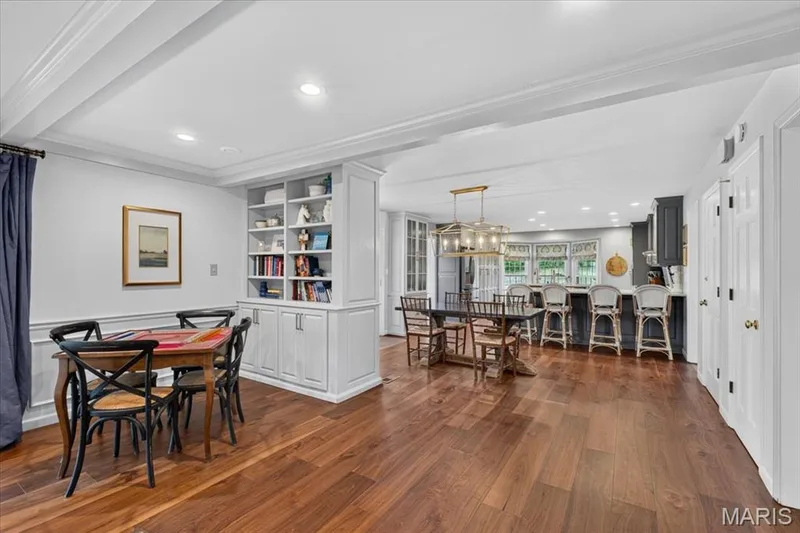 The built-ins add practical use and architectural detail to this main living space; bonus spot for game table — 1165 Templeton Place, Chesterfield, MO 63017
