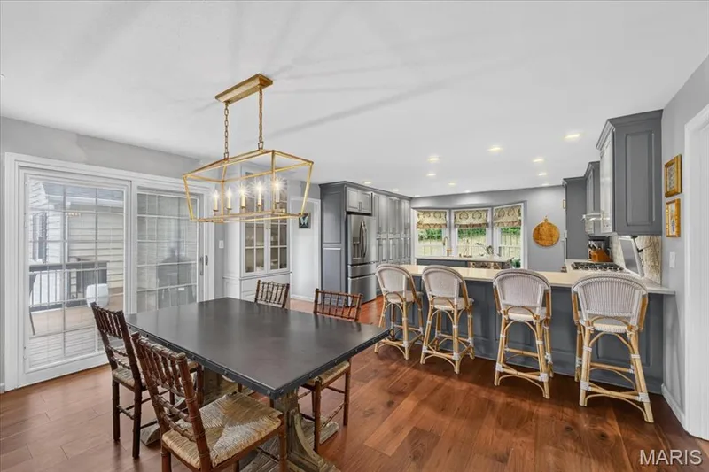 Another pretty lighting fixture highlights the open breakfast area — 1165 Templeton Place, Chesterfield, MO 63017