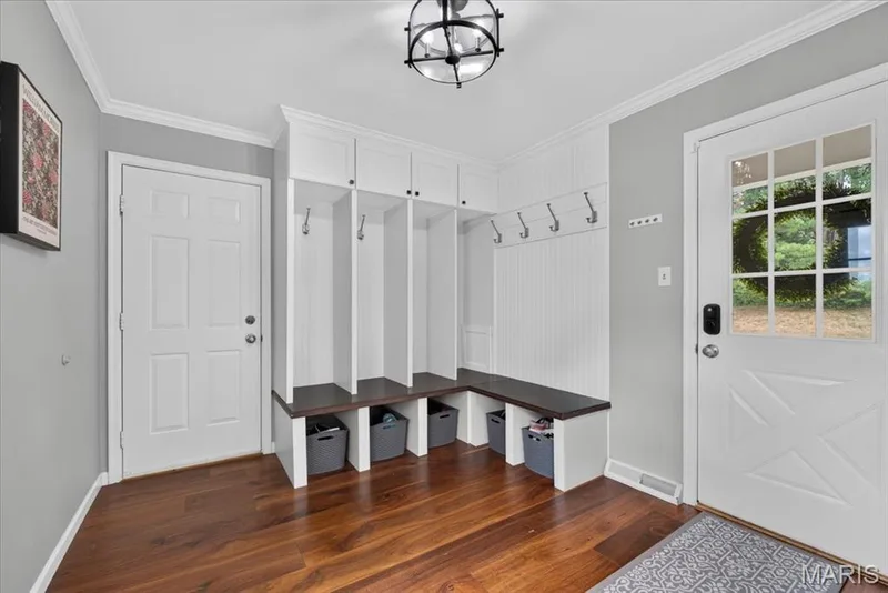 Oversized mudroom with lockers and main floor laundry.  Side entry to driveway — 1165 Templeton Place, Chesterfield, MO 63017