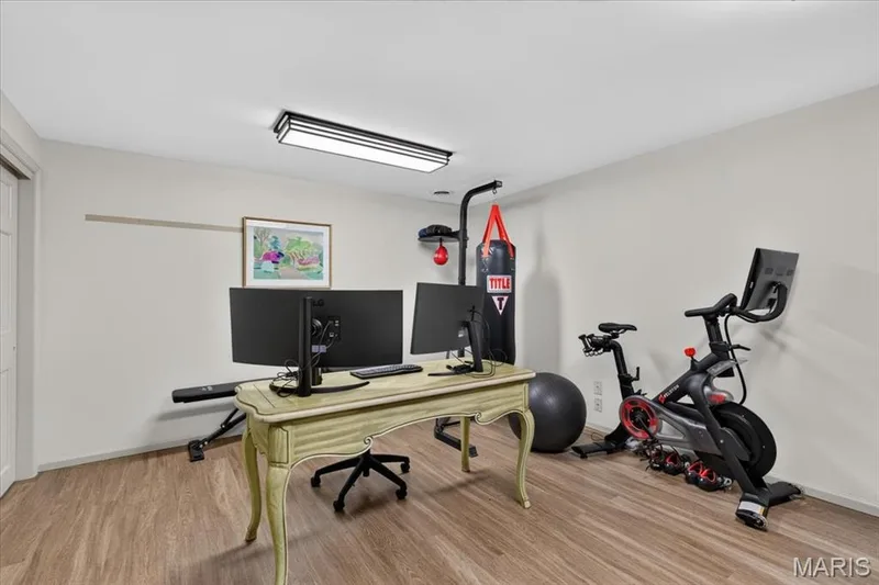 The extra room in lower level is currently used for office work & fitness — 1165 Templeton Place, Chesterfield, MO 63017