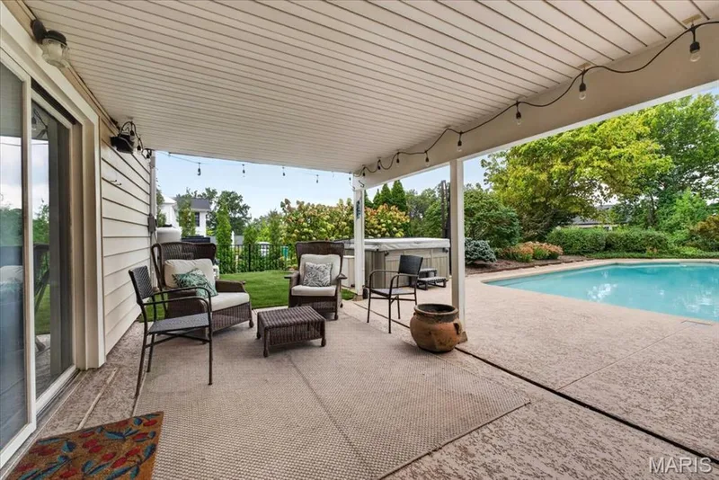 The covered patio under the sun room and is a favorite entertaining spot — 1165 Templeton Place, Chesterfield, MO 63017