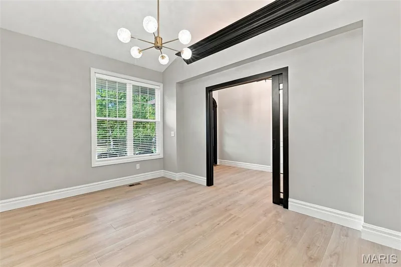 This can also be a front office, has recessed sliding glass doors — 1580 Madre Drive, Foristell, MO 63348