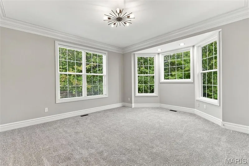 bedroom featuring a bay window, recessed lighting, crown molding, and light gray wall paint — 1580 Madre Drive, Foristell, MO 63348