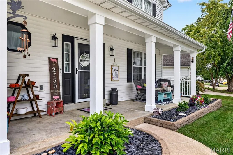 great porch and professionally landscaped — 2750 Red Cedar Parc Drive, O'Fallon, MO 63368