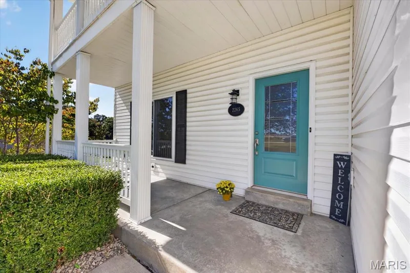 A covered front porch that feels like home from the moment you arrive. — 2265 Mette Road, Wentzville, MO 63385