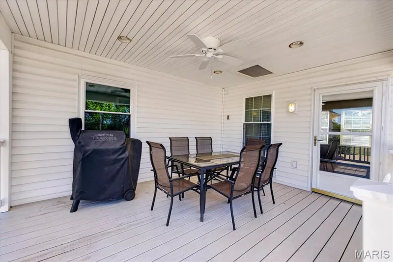 The sunroom opens directly to the deck, making indoor-outdoor living easy! — 2265 Mette Road, Wentzville, MO 63385