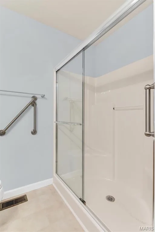 Primary bath has easy, step-in shower w/handgrips. — 18 Country Bluff Court, St Charles, MO 63301