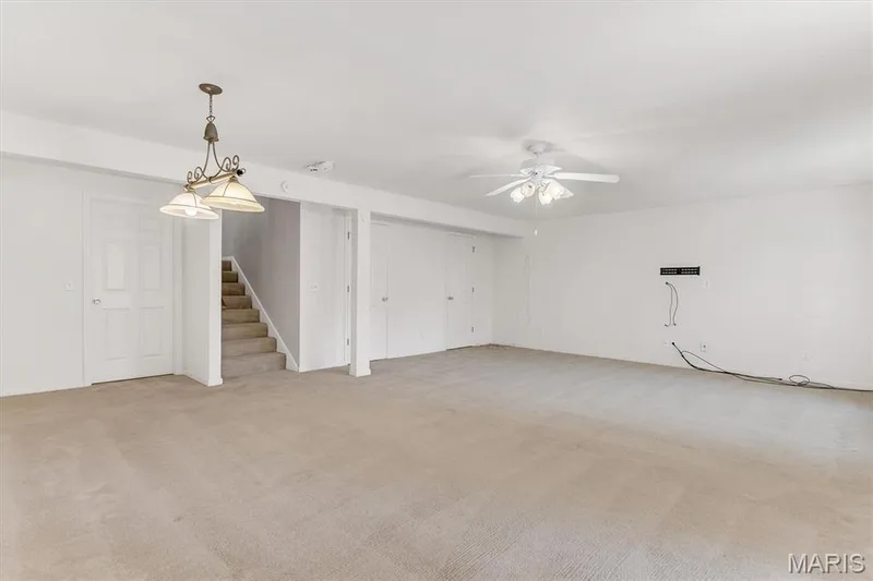 Lower level rec room/family room has large, separate storage. — 18 Country Bluff Court, St Charles, MO 63301