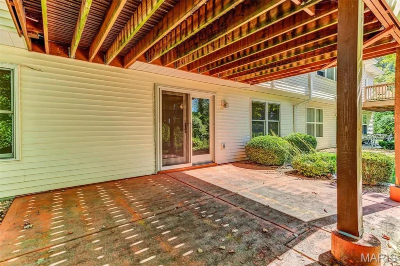 Covered patio & walk-out slider door to finished basement. — 18 Country Bluff Court, St Charles, MO 63301