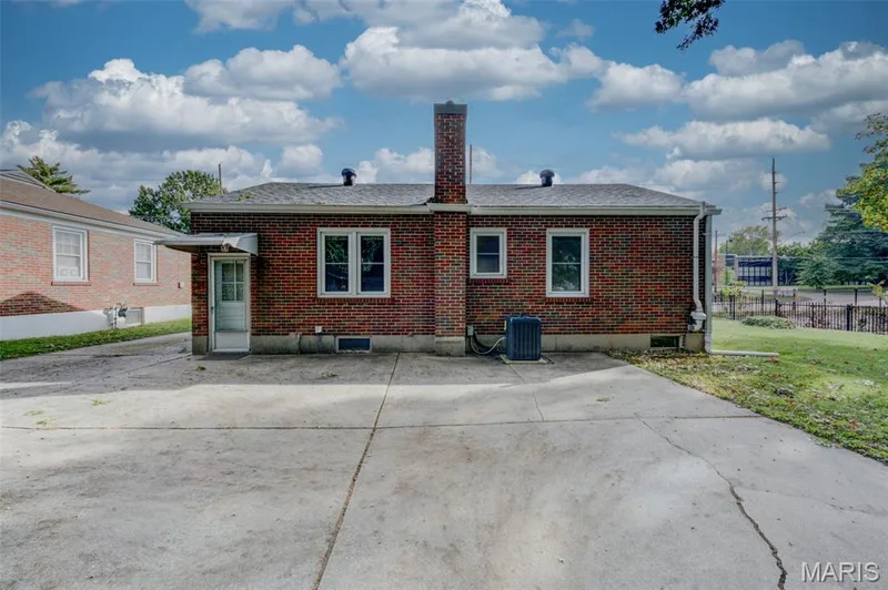Rear entrance with large concrete patio for additional parking — 2121 Elm Street, St Charles, MO 63301