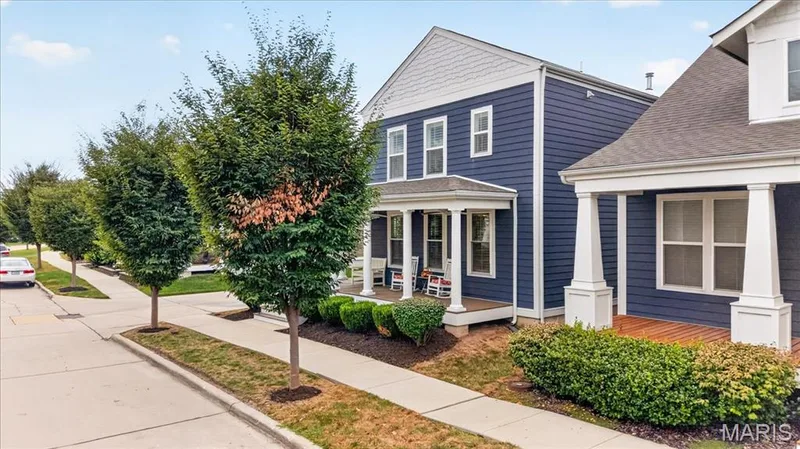 Two-story exterior with blue siding, white trim, and a covered porch — 3708 Broad Street, St Charles, MO 63301