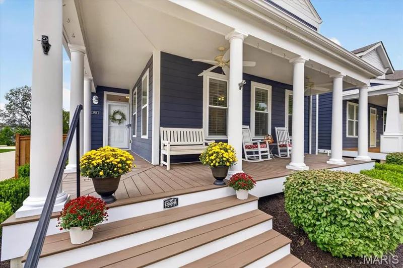 Inviting front porch featuring white columns and wood-finish decking — 3708 Broad Street, St Charles, MO 63301