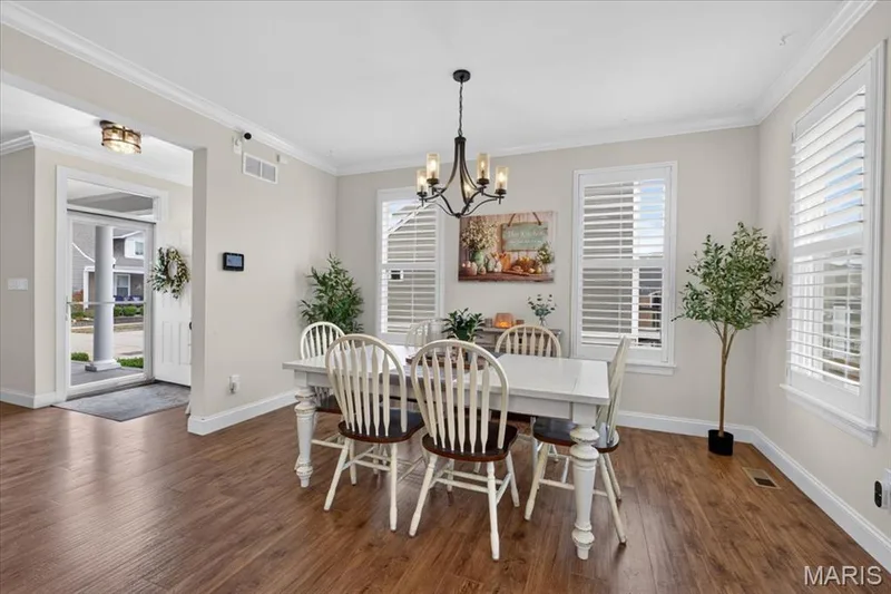 Wood-finish flooring throughout, crown molding details, and recessed lighting — 3708 Broad Street, St Charles, MO 63301