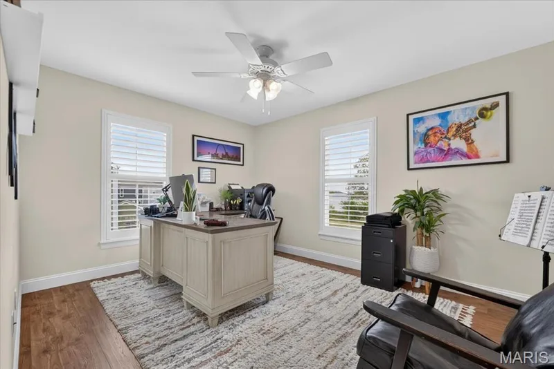 Wood-finish flooring, light-toned walls, and a ceiling fan with integrated lighting — 3708 Broad Street, St Charles, MO 63301