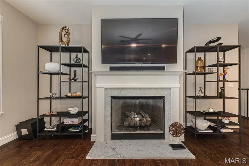 Fireplace featuring a white mantel, marble surround, and marble hearth — 1229 Cashmere Lane, St Peters, MO 63376