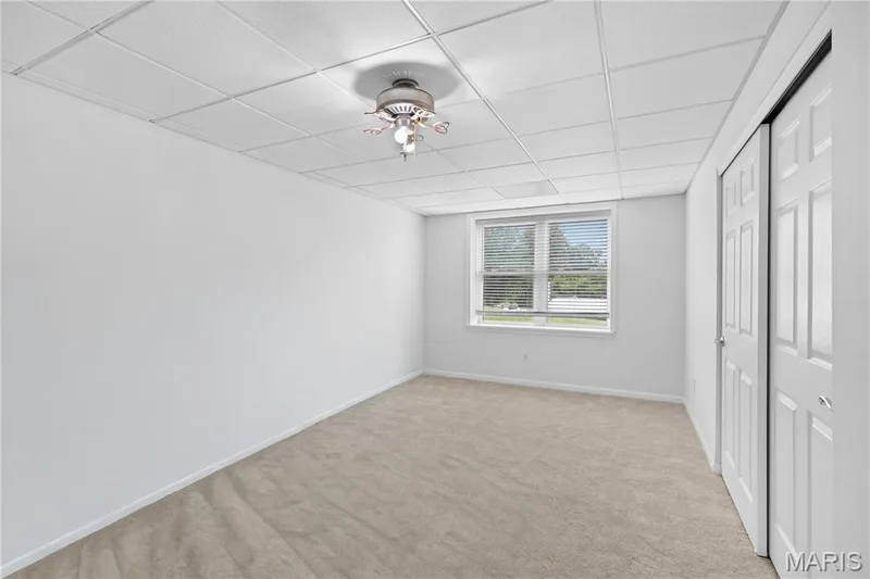 Neutral wall color with plush carpet flooring — 104 Wolf Trail Court, Defiance, MO 63341