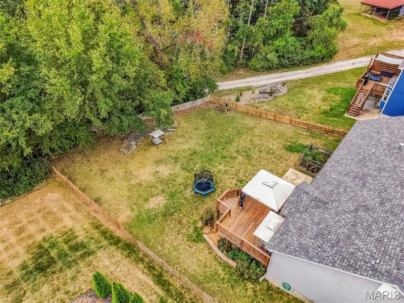 Large backyard backs to trees and private a road — 1840 Autumn Trail, Wentzville, MO 63385