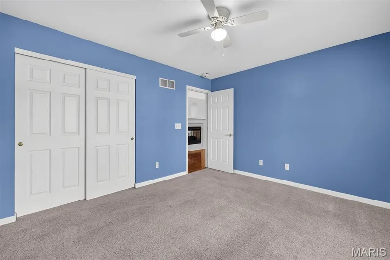 Recessed lighting, ceiling fan, white paneled doors, and wall-to-wall carpeting — 20 Autumn Ridge Drive #83B, O'Fallon, MO 63366