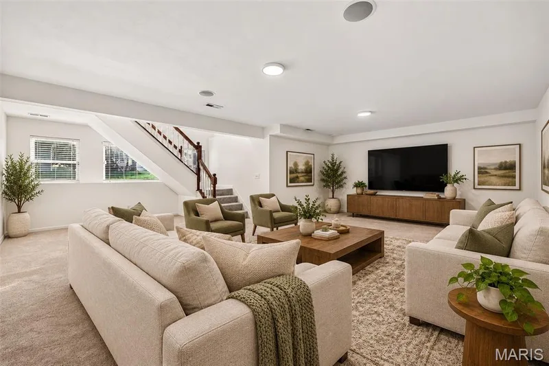 Carpeted flooring throughout, recessed lighting, and a staircase with wood-finish handrails — 20 Autumn Ridge Drive #83B, O'Fallon, MO 63366