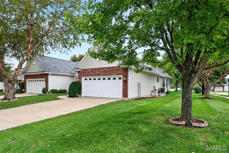 Brick and siding exterior with a pitched roof — 20 Autumn Ridge Drive #83B, O'Fallon, MO 63366
