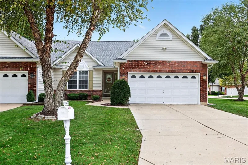 Brick and siding exterior with a gabled roof — 20 Autumn Ridge Drive #83B, O'Fallon, MO 63366