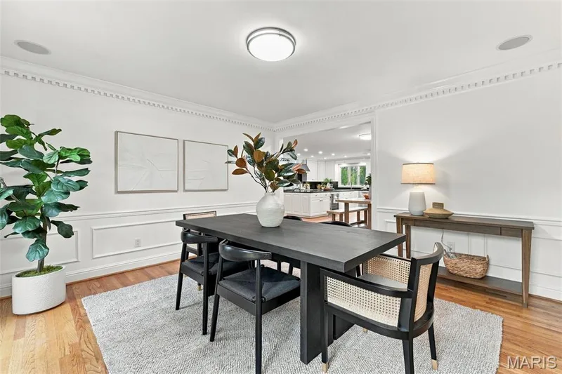 Hardwood flooring, crown molding, wall paneling, recessed lighting, and a wide entryway — 2785 Sun Meadow Drive, Wildwood, MO 63005